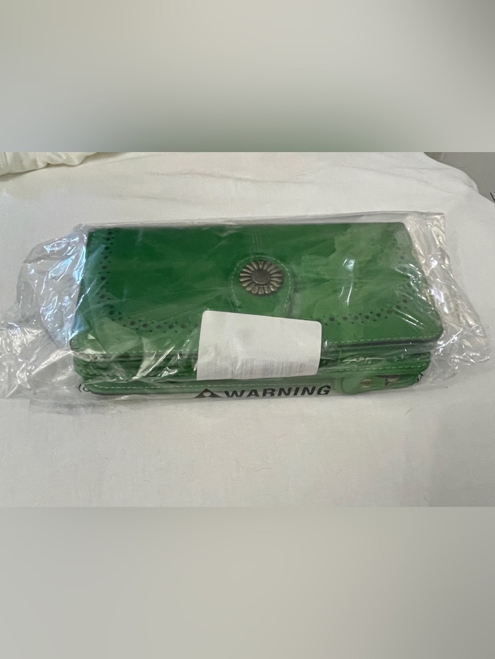Structured Green Flap Wallet with Decorative Medallion